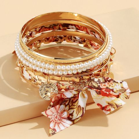 Vacation Modern Style Geometric Bow Knot Alloy Cloth Wholesale Bangle
