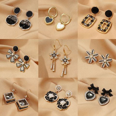 1 Pair Elegant Flower Bow Knot Plating Inlay Alloy Artificial Gemstones Gold Plated Drop Earrings