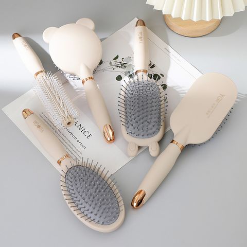 Simple Style Oval Bear Solid Color Plastic Nylon Rubber Hair Combs
