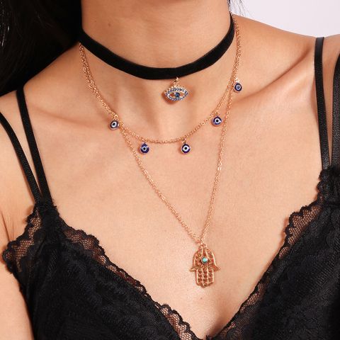 Ethnic Style Modern Style Devil's Eye Palm Fabric Zinc Alloy Plating Hollow Out Inlay Turquoise Rhinestones Women's Layered Necklaces