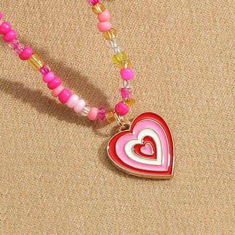 Vintage Style Gossip Plaid Heart Shape Beaded Alloy Enamel Women's Pendant Necklace