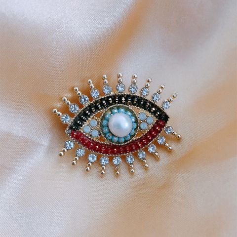 Retro Devil's Eye Alloy Pearl Inlay Artificial Gemstones Unisex Brooches