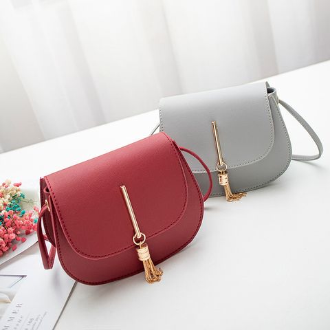 Women's Small Pu Leather Solid Color Elegant Tassel Oval Magnetic Buckle Crossbody Bag