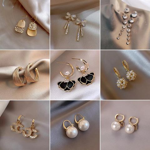 1 Pair Elegant Lady Geometric Bow Knot Plating Inlay Imitation Pearl Alloy Artificial Gemstones Drop Earrings