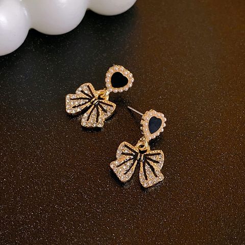 1 Pair Sweet Bow Knot Plating Inlay Alloy Artificial Pearls Artificial Diamond Drop Earrings