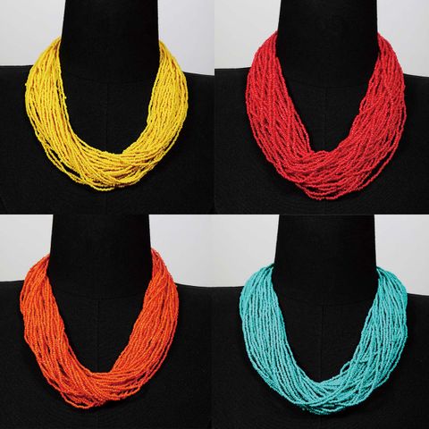 Style Ethnique Romantique Couleur Unie Rond Plastique Perle De Rocaille Perlé Chaîne Femmes Collier En Couches Chaîne De Chandail