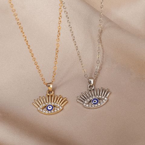 Estilo Vintage Ojo Del Diablo Aleación Embutido Diamantes De Imitación Artificiales Mujeres Collar Colgante