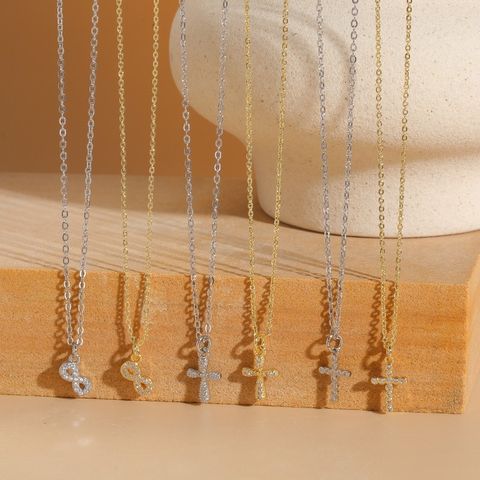 Elegant Einfacher Stil Kreuzen Unendlichkeit Kupfer 14 Karat Vergoldet Weißgold Plattiert Zirkon Halskette Mit Anhänger In Masse