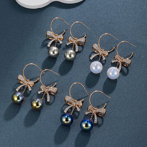 1 Paar Elegant Glam XUPING Bogenknoten Inlay Legierung Kupferlegierung Künstliche Edelsteine Künstliche Perlen 18 Karat Vergoldet Tropfenohrringe