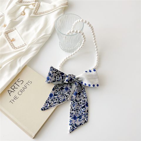 Cute Sweet Stripe Flower Bow Knot Artificial Pearl Polyester Beaded Printing Women's Sweater Chain