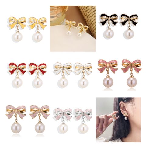 1 Pair Simple Style Classic Style Bow Knot Plating Alloy Zinc Alloy Drop Earrings