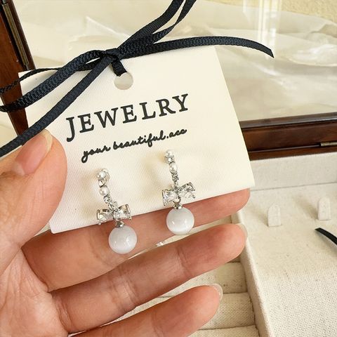 1 Pair Elegant Bow Knot Inlay Imitation Pearl Copper Zircon Zircon Silver Plated Drop Earrings