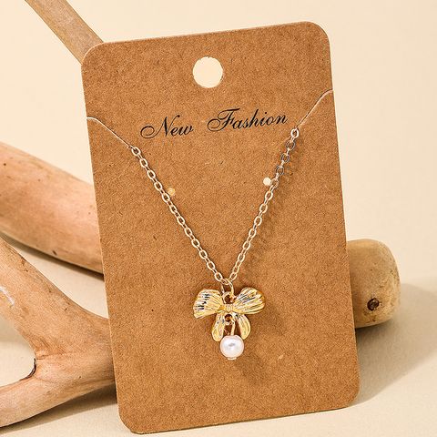 Sweet Bow Knot Alloy Plating Artificial Pearls Women's Pendant Necklace 1 Piece