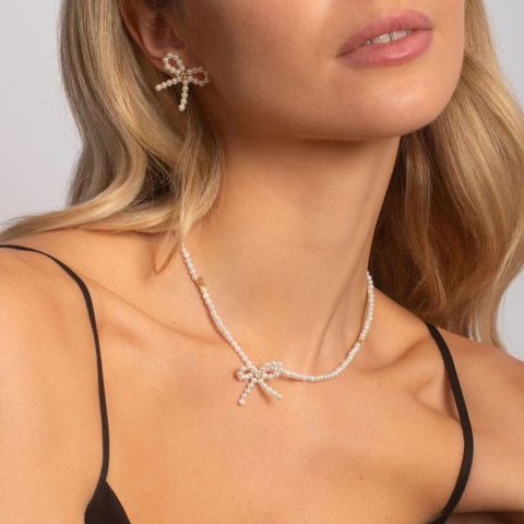 IG-Stil Elegant Dame Bogenknoten Sterling Silber Überzug Inlay Künstliche Perlen Zirkon Versilbert Frau Ringe Ohrringe Halskette