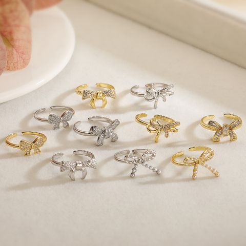 Wholesale Simple Style Commute Bow Knot Copper Hollow Out Inlay 18K Gold Plated White Gold Plated Zircon Open Rings