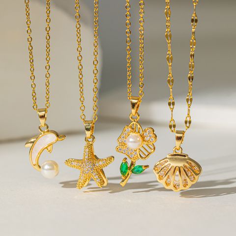 304 Stainless Steel 18K Gold Plated Casual Simple Style Commute Polishing Inlay Starfish Dolphin Flower Acrylic Artificial Rhinestones Pearl Pendant Necklace