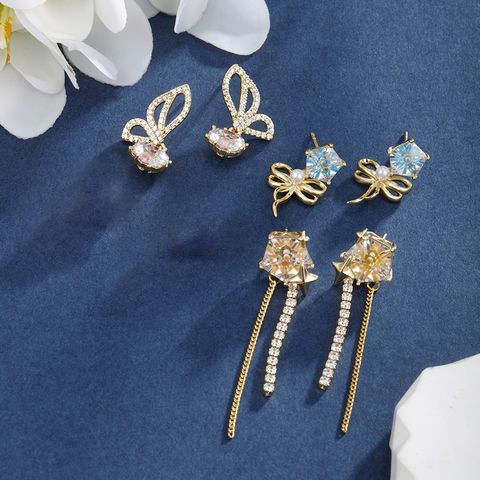 1 Pair Fairy Style XUPING Sweet Geometric Bow Knot Tassel Plating Inlay Copper Artificial Gemstones 18K Gold Plated Drop Earrings
