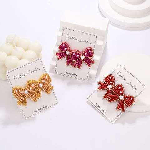 1 Pair Casual Elegant Simple Style Bow Knot Inlay Beaded Seed Bead Artificial Pearls Ear Studs