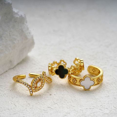 Copper Brass Gold Plated Simple Style Classic Style Asymmetrical Inlay Four Leaf Clover Shell Zircon Open Rings