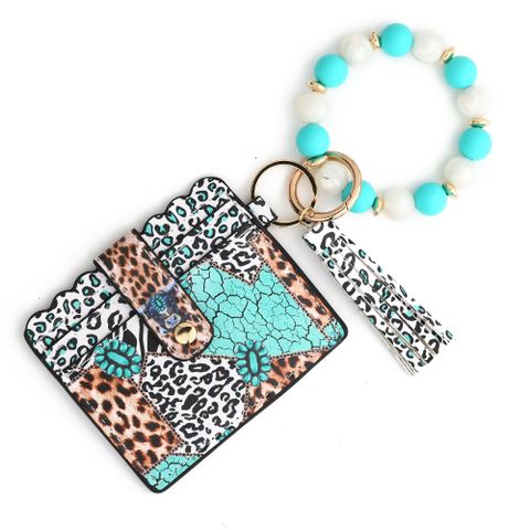 Casual Ethnic Style Sunflower Solid Color Leopard Pu Leather Beaded Tassel Keychain