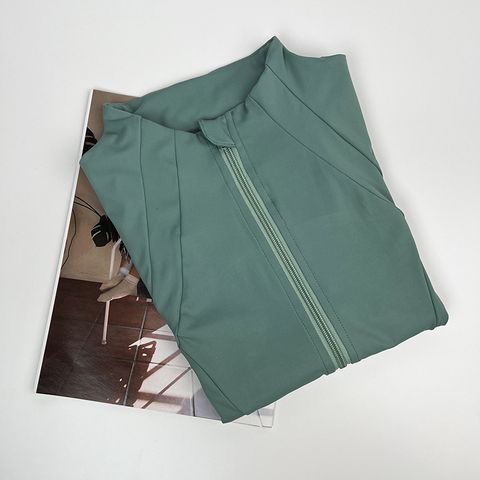 Simple Style Solid Color Nylon Cotton Blend Round Neck Tracksuit Coat Skinny Pants Sweatpants