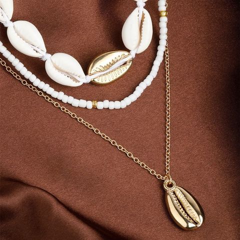 Einfacher Stil Klassischer Stil Einfarbig Legierung Hülse Perlen Frau Geschichtete Halskette