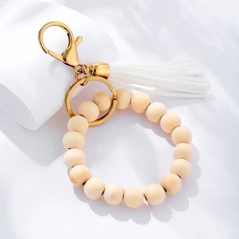 IG Style Elegant Classic Style Round Wooden Beads Rope Metal Beaded Tassel Bag Pendant Keychain