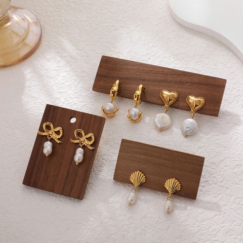 1 Pair Cute Simple Style Bow Knot Inlay Imitation Pearl Copper Pearl Drop Earrings