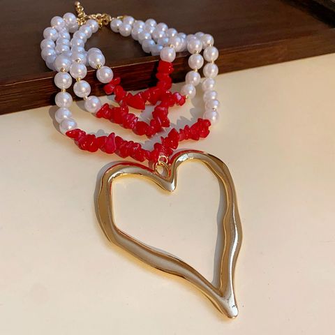 Glam Exaggerated Heart Shape Imitation Pearl Alloy Wholesale Pendant Necklace