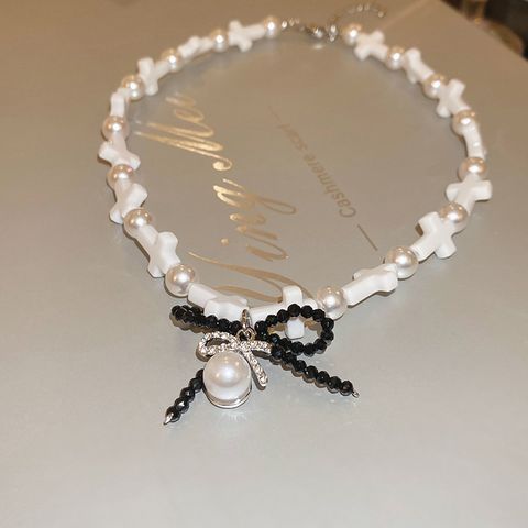 Retro Simple Style Cross Bow Knot Resin Beaded Inlay Pearl Zircon Women's Necklace