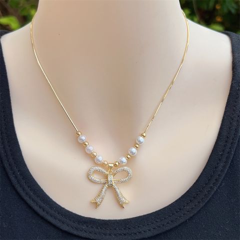 Imitation Pearl Copper 18K Gold Plated IG Style Sweet Beaded Inlay Bow Knot Zircon Pendant Necklace