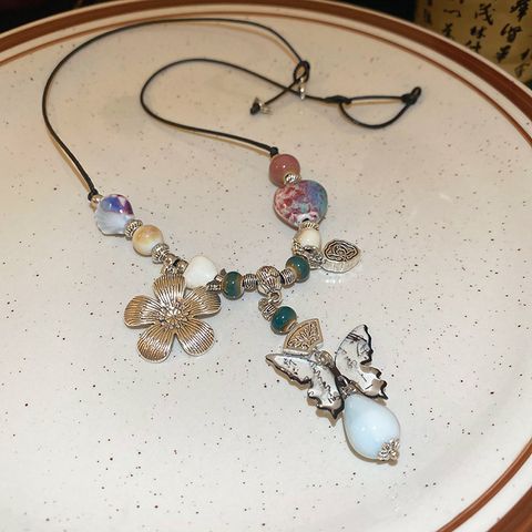 Retro Ethnischer Stil Blume Schmetterling Seil Keramik Perlen Frau Halskette Mit Anhänger