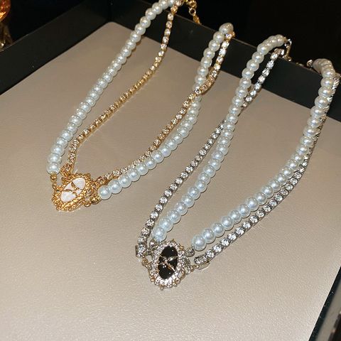 Elegant Einfacher Stil Runden Legierung Emaille Perle Inlay Strasssteine Frau Doppellagige Halsketten