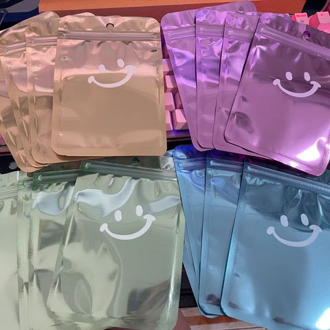 Einfacher Stil Lächelndes Gesicht Einfarbig Aluminium Folie Schmuck Verpackungstaschen