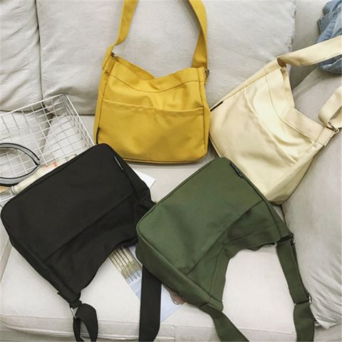 Women's Medium Canvas Solid Color Vintage Style Zipper Messenger Bag