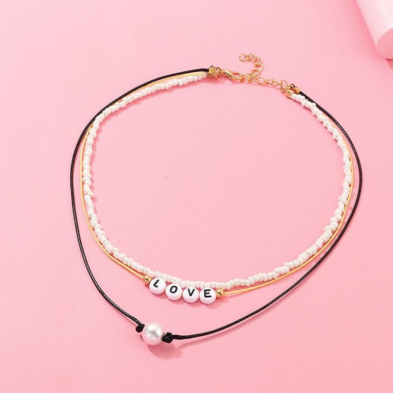 Hand-woven Pearl White Rice Beads Love Necklace Nhnz157557