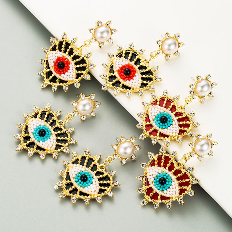 Exquisite Devil's Eyes Diamond-studded Pearl Heart-shaped Earrings