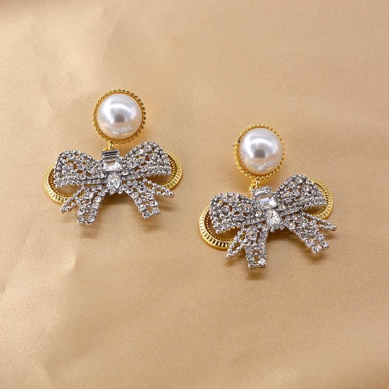 New Baroque Flash Diamond Elegant Pearl Bow 925 Silver Pin Earrings Wholesale