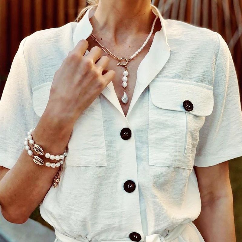 Nueva Moda Coreana Aleación Asimétrica Collar De Perlas Moda Simple Colgante Retro Al Por Mayor