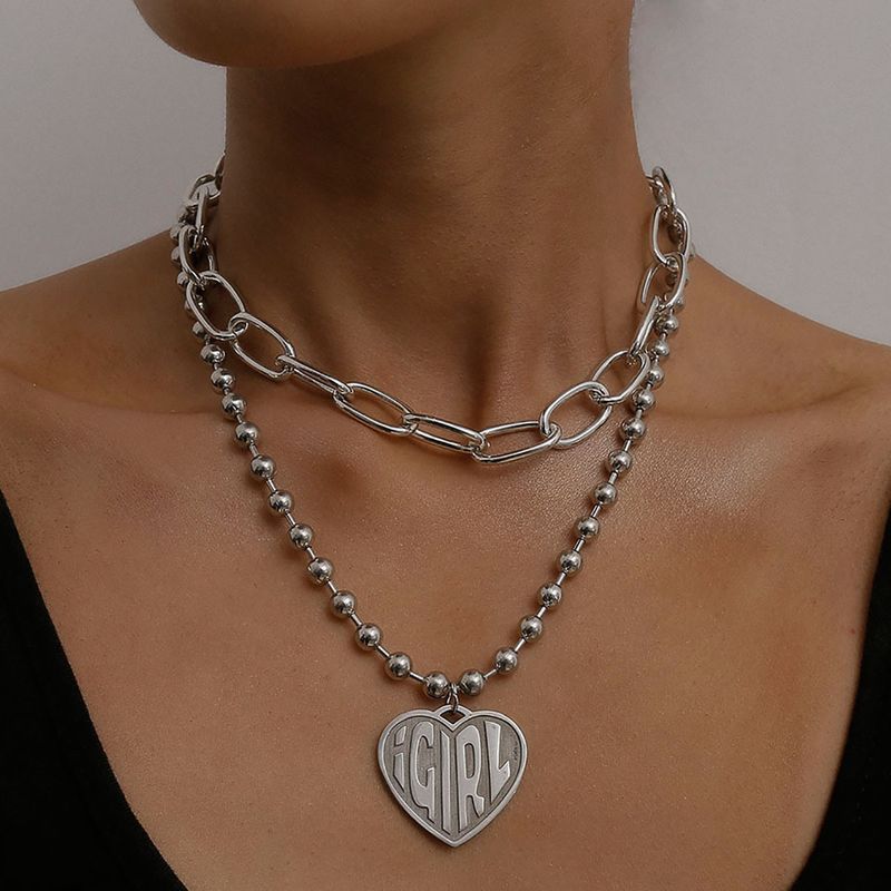 Joyería De Moda Yiwu Nihaojewelry Accesorios De Cadena De Cuentas Cruzadas Exageradas Al Por Mayor Femeninas Collar De Alivio De Letra En Forma De Corazón Retro