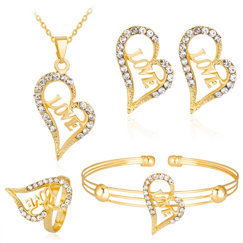 Nouvelles Lettres Creuses Amour Amour Diamant Placage Kc Collier Boucles D&#39;oreilles Bague Bracelet Quatre Pièces En Gros Nihaojewelry