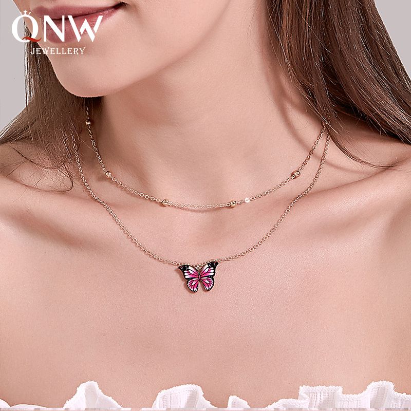 Vente Chaude Rétro Double Couche Perle Papillon Collier Fantaisie Couleur Papillon Chaîne De Clavicule Femmes