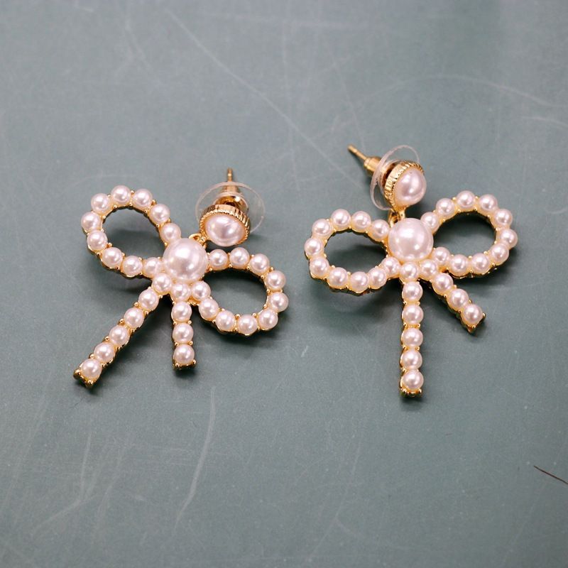 Hersteller Liefern Hohle Schleifen Silberne Nadel Ohrringe Kleine Perlen Elegante Schleifen Ohrringe Süße Ohrringe