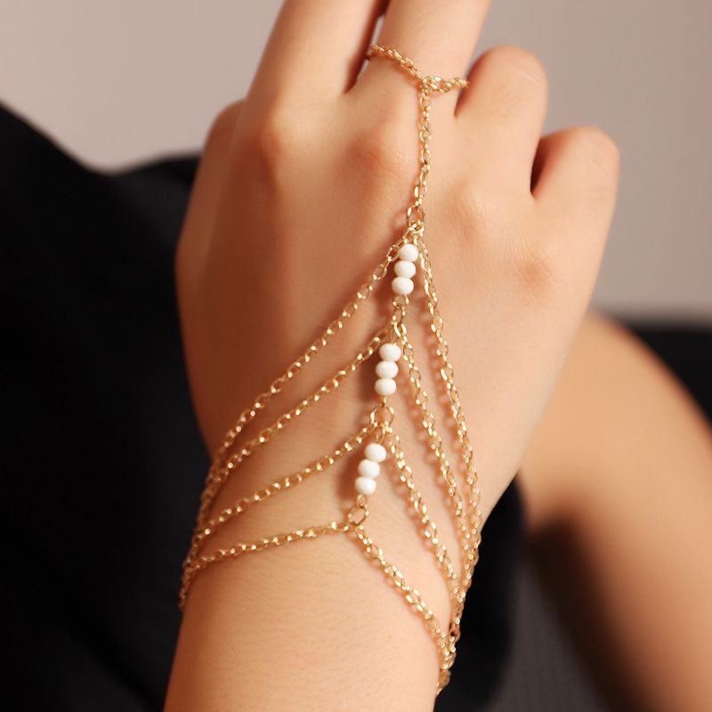 Modetrend Goldene Dünne Kette Mehrschichtig Finger Ein Reisperlen Armband Für Frauen