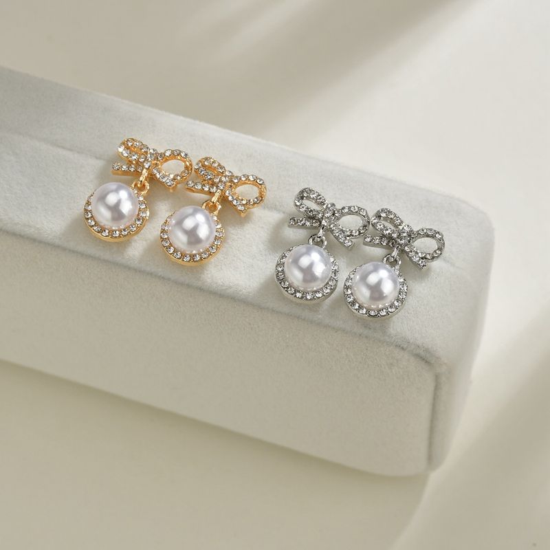 S925 Silbernadel Korea Süße Und Süße Fairy Fashion Bogen Perle Legierung Ohrringe Großhandel