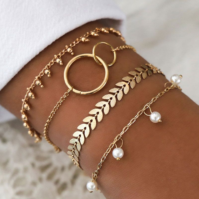 Metall Einfache Gold Und Weiße Perle Vierteilige Kombination Armband Großhandel