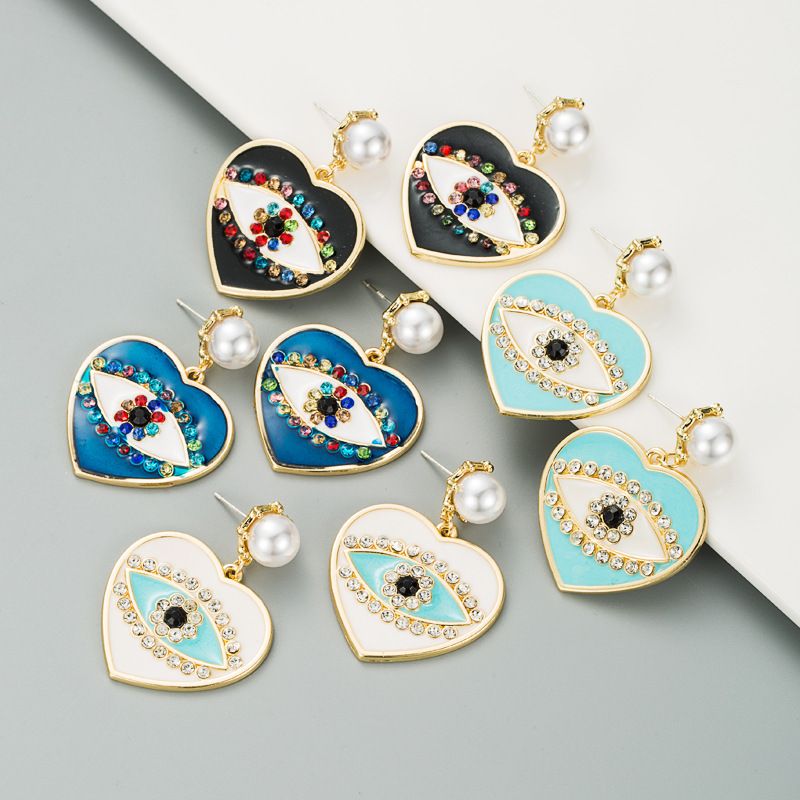 Fashion Heart-shaped Demon Eyes Imitation Pearl Earrings