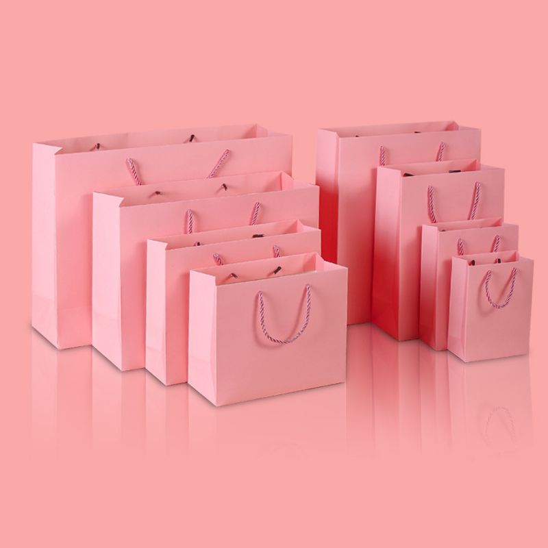 Bolsa De Papel Rosa Bolsa De Papel Kraft De Regalo De Tarjeta Blanca Bolsa De Embalaje De Ropa Personalizada Bolsa De Compras De Papel Kraft Bolsa De Papel Portátil Fabricante