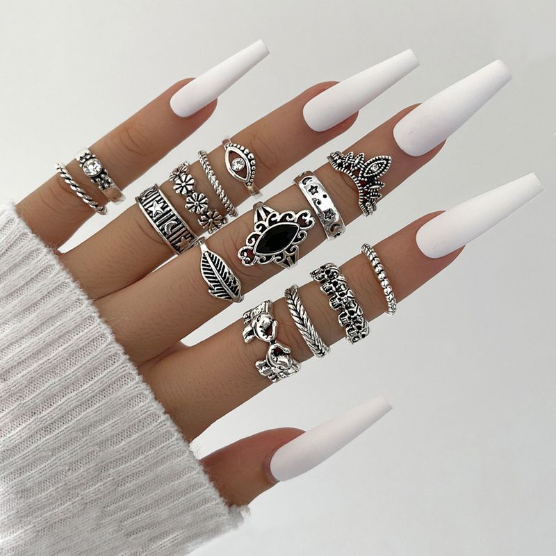 Europe And America Cross Border Ornament Personalized Retro Black Diamond Embossed Elephant Skull Flower Combination Knuckle Ring Four-piece Set