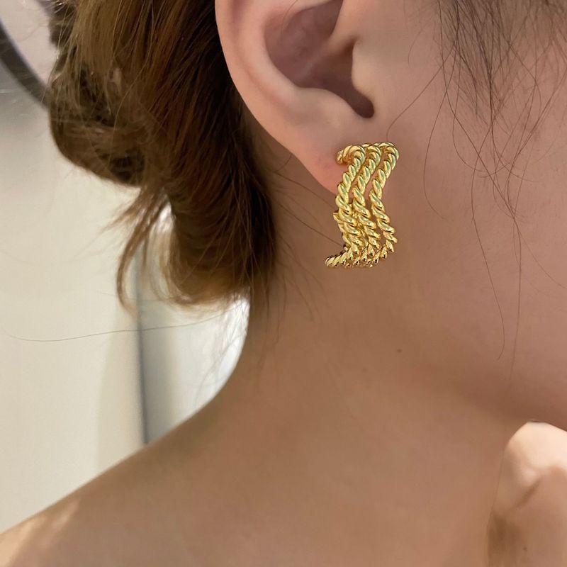 Fashion Gold Plated Metal Texture Wave Winding Earrings